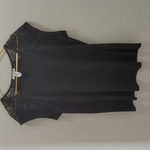 Extra large, black polyester shirt with  laced short sleeves.
